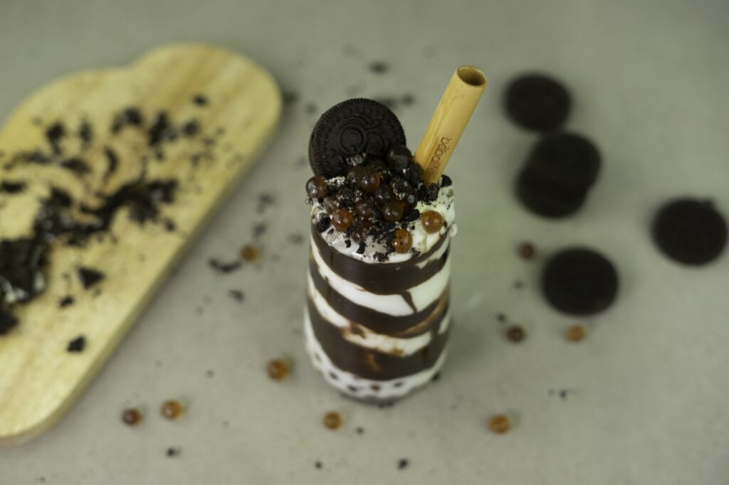 Chocolate shake topped with a biscuit and pearls