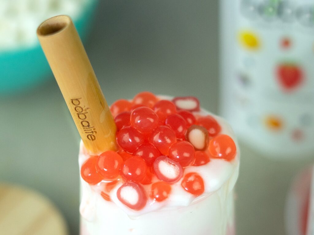 Strawberry popping boba on a shake
